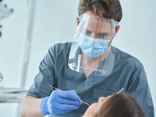 exit-factor-usa-male-dentist-and-woman-in-dentist-office-original-67da25461a556